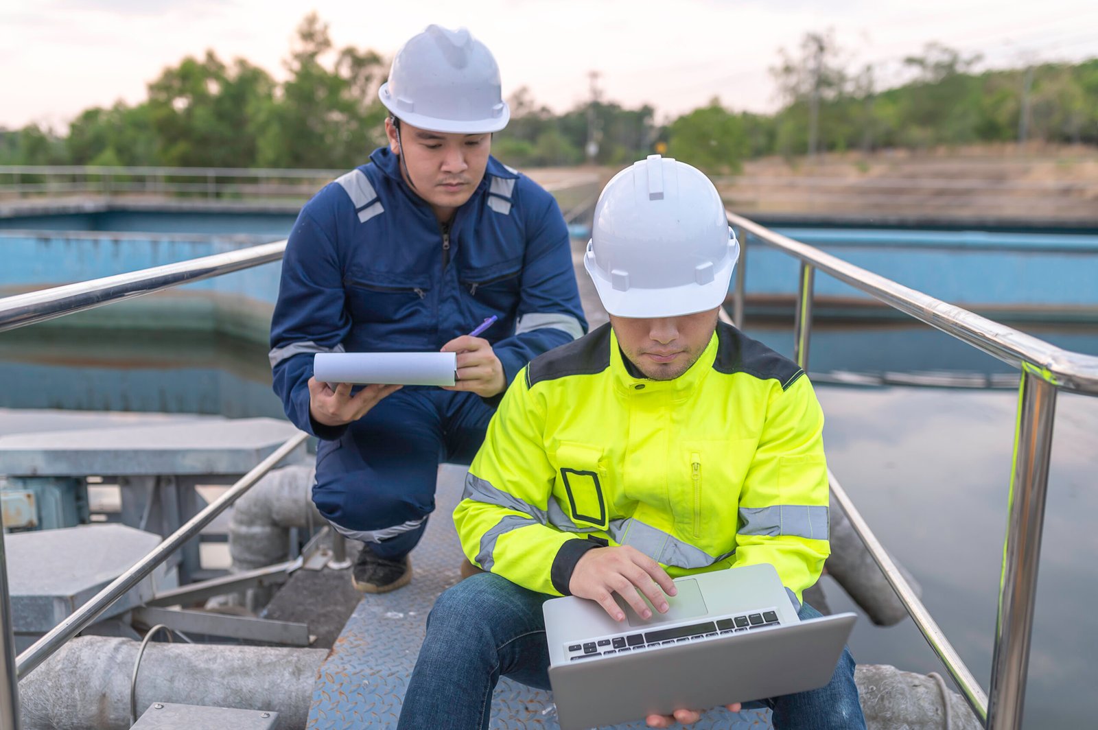 Environmental engineers work at wastewater treatment plants,Water supply engineering working at Water recycling plant for reuse,Technicians and engineers discuss work together.