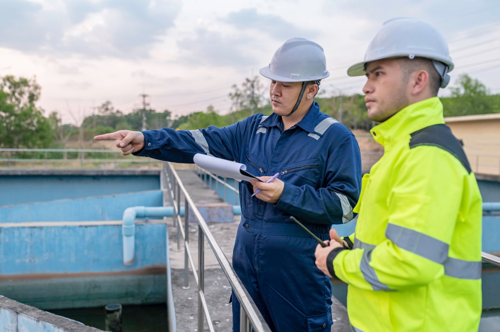 Environmental engineers work at wastewater treatment plants,Water supply engineering working at Water recycling plant for reuse,Technicians and engineers discuss work together.