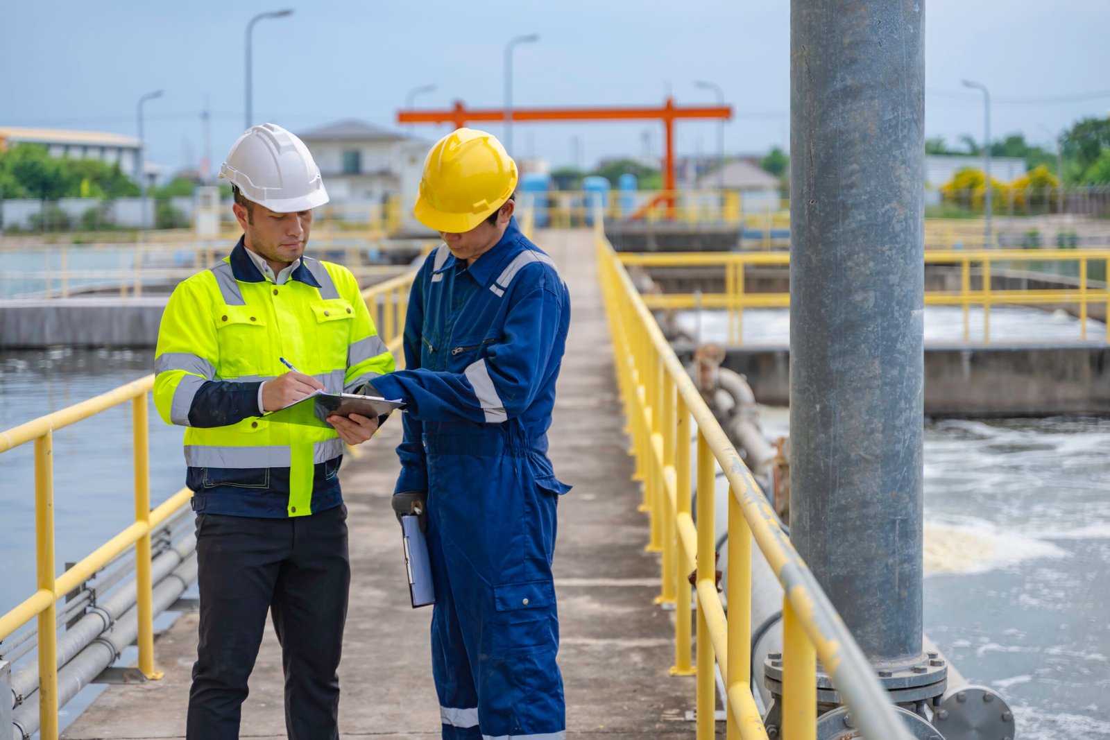 Environmental engineers work at wastewater treatment plants,Water supply engineering working at Water recycling plant for reuse,Technicians and engineers discuss work together.