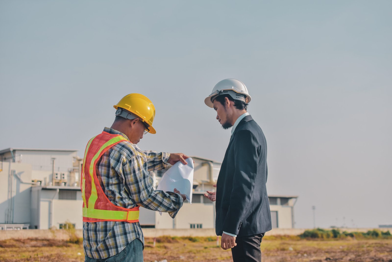 Asian man Business talking outdoor on site construction